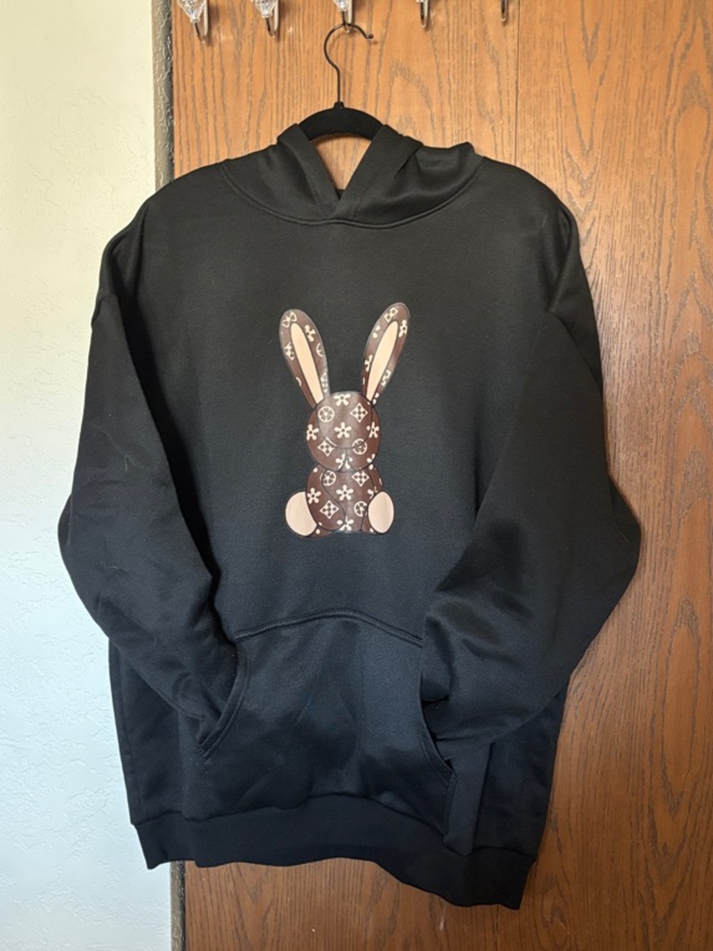 Black Hoodie with Brown Patterned Bunny Graphic